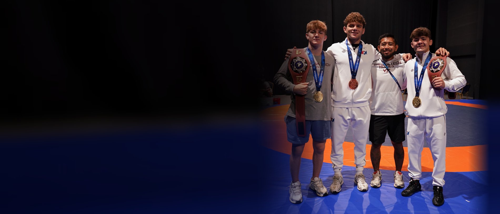 Ryan Burton, Bo Bassett and Aaron Seidel with their U20 World medals on the mat in Bratislava